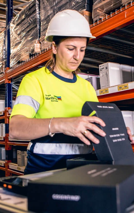Two women discussing business with documents